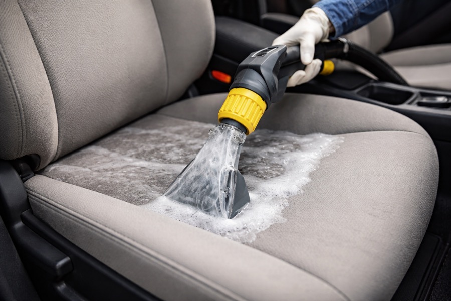 Hot water extraction cleaning a car seat